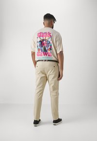 Jack's Sportswear SUPERFLEX PANTS - Chino hlače - dusty sand