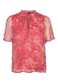 Blouse fleurie rose en tissu léger et transparent. Elle présente des manches bouffantes, un col volanté et une ouverture en forme de trou de serrure à l'avant.