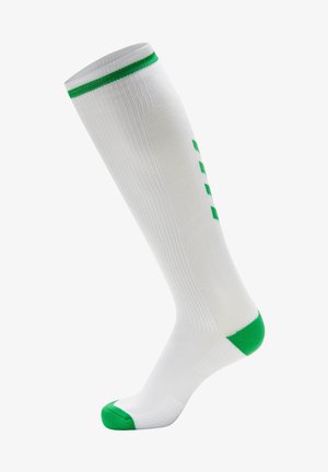 Biała skarpetka do kolan z zielonymi akcentami na górze i palcach, charakteryzująca się prążkowaną teksturą oraz wzorem zielonych kwadratów wzdłuż boku.