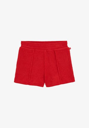 Piros rövidnadrág struktúrált, bordázott anyagból. Rugalmas derékpánttal és elülső redőkkel rendelkezik. Nincsenek zsebek vagy egyéb fém részek.