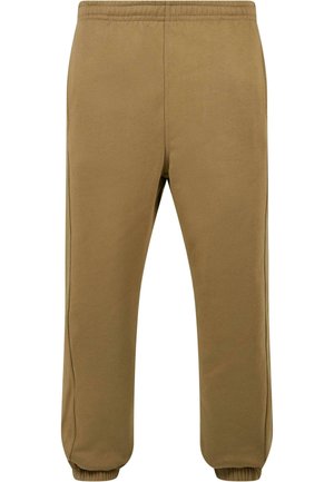 Pantaloni de jogging din fleece maro, cu talie elastică, picioare conice și manșete striate. Textură netedă cu detalii la cusăturile laterale.