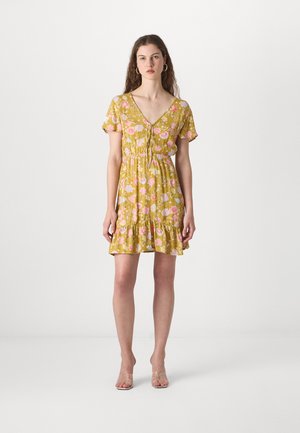 Floral-patterned yellow dress with a V-neck, short sleeves, and a ruffled hem. Made from a lightweight fabric with a soft texture.