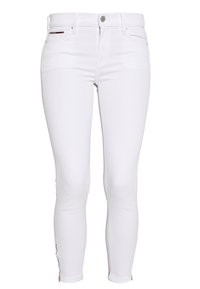 Vita smala jeans i denim med en figurnära design, diskreta sömmar och dragkedjeinslag vid bensluten. Klassisk femficksstil.