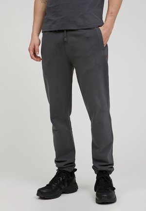 AADAN - Tracksuit bottoms - acid black