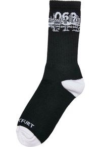 Schwarze Baumwollsocke mit weißem grafischem Design, gerippter Textur und kontrastierenden weißen Akzenten an Zehen und Ferse. Der Text lautet "006".