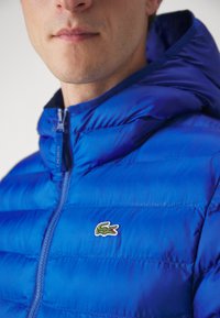 Lacoste Outdoorová bunda - bleu