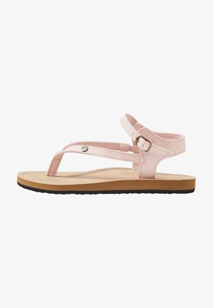Sandalia plana de color rosa claro con separador de dedos, correa ajustable en el tobillo con hebilla, plantilla beige y suela exterior de goma negra.