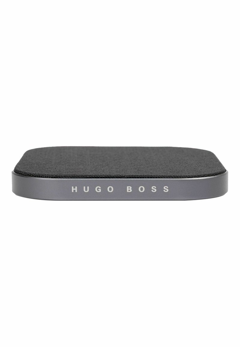 Black textured surface with gray metal edge; "HUGO BOSS" embossed on the side; rectangular shape, flat design, minimalistic style.