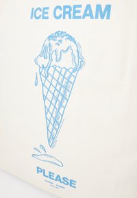 Canvas tote bag featuring a blue line drawing of an ice cream cone with melting ice cream, above the text "ICE CREAM PLEASE."