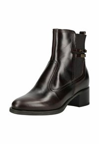 Bottine en cuir marron avec des panneaux latéraux élastiques, un bout rond et un petit talon bloc. Présente des éléments en métal doré pour le détail.