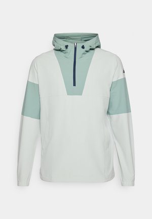 Vaaleanvihreä huppari, joka on valmistettu teksturoidusta kankaasta ja jossa on puolivälissä vetoketju, kengurun tasku sekä kontrastina tummemman vihreät yksityiskohdat.