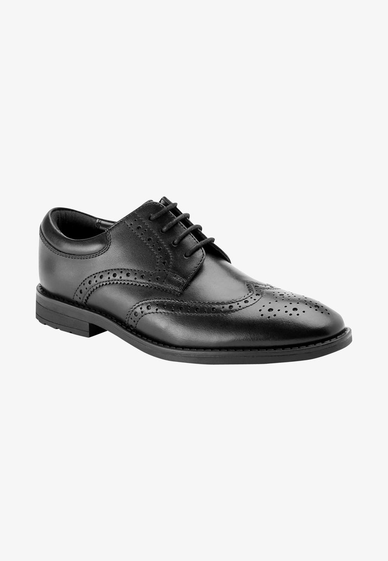 Pantofi din piele neagră cu vârf ascuțit, detaliu brogue, închidere cu șireturi, vârf rotunjit și accente cusute pe o talpă de cauciuc joasă.