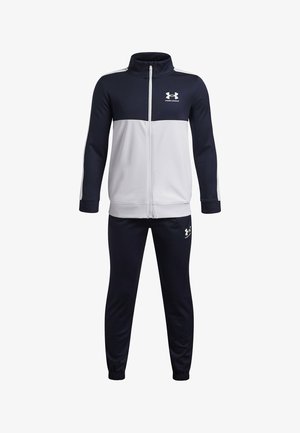 Marineblauw-grijs sporttrainingspak met een jas met ritssluiting en broek met elastische tailleband. Voorzien van het Under Armour-logo en lange mouwen. Moderne pasvorm.