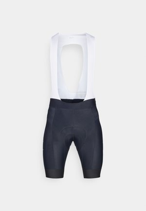 Pantaloni da ciclismo da uomo con bretelle bianche, realizzati in tessuto elasticizzato; colore blu navy con imbottitura per il comfort e cuciture minime.