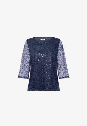 Námornícky modrý top s priesvitnými, vzorovanými rukávmi. Textúrovaná látka zdobená flitrami, okrúhly výstrih a rukávy po tri štvrtiny.