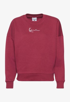 Bordeaux sweatshirt lavet af blødt stof, med en afslappet pasform, ribstrikkede manchetter og kant, samt hvidt broderet logo på forsiden.