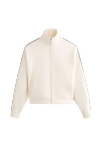 Béžovo-biela bunda na zips s vysokým golierom, dlhými rukávmi, bočnými vreckami a tenkými tmavými pruhmi pozdĺž ramien a rukávov.