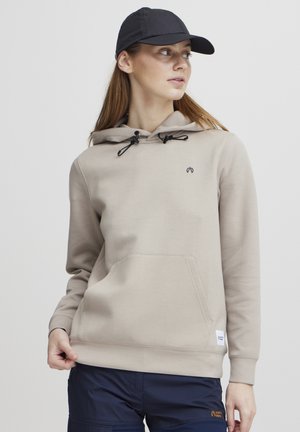 Haut à capuche beige avec cordon de serrage, poche avant et logo. Manches longues avec poignets côtelés, fabriqué en tissu doux et texturé.