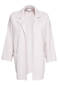 Cardigan blanc surdimensionné à ouverture frontale large, avec larges revers, épaules tombantes, manches mi-longues et poches plaquées à l'avant.