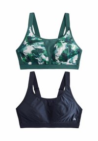 Due reggiseni sportivi: uno presenta un motivo astratto verde e bianco; l'altro è di un blu navy uniforme. Entrambi hanno spalline larghe e un design supportivo.