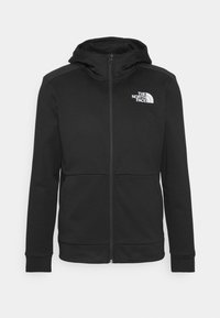 Czarna bluza z kapturem na zamek, wykonana z gładkiego materiału, z kapturem, ściągaczami przy rękawach oraz logo The North Face na górnej lewej części klatki piersiowej.