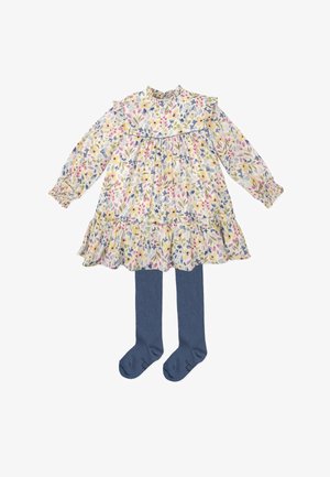 Vestido largo de flores en crema con detalles en rosa, amarillo y azul, que cuenta con un cuello con volantes y un dobladillo en capas. Incluye leggings de mezclilla.