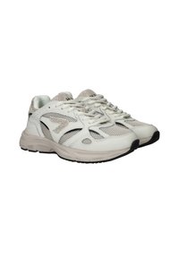 White athletic shoes with mesh panels, textured accents, and black rubber soles. Features laces and a cushioned sole design.