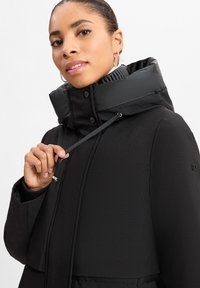 DUNO CHARLENE - Piumino lungo - schwarz