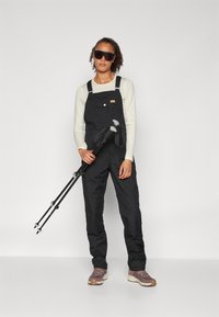 Fjällräven VARDAG DUNGAREE TROUSERS W - Hlače za na prostem - black