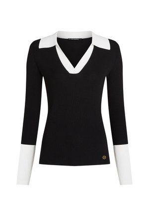 Black ribbed long-sleeve top with a white V-neck collar and white cuff accents; features a small gold logo detail near the hem.