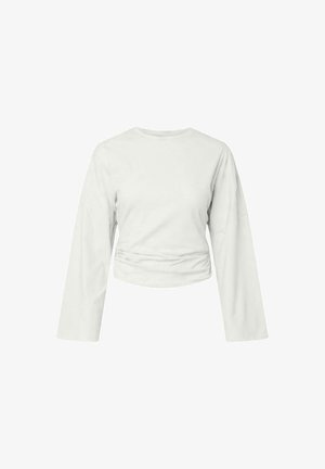 Bílý dlouhý rukáv s oříznutým střihem, kulatým výstřihem a jemným nařasením v pase.