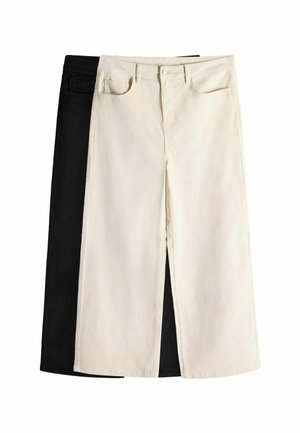 Two pairs of straight-leg jeans, one in black denim and one in cream. Both feature front pockets, belt loops, and a button fly.
