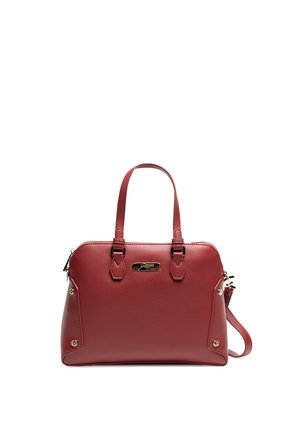 Red leather handbag with dual handles, zip closure, gold-tone hardware, and decorative accents on the sides. Smooth texture, structured design.