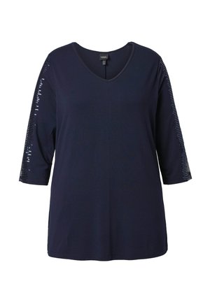 Marineblauw V-hals top met driekwart mouwen, voorzien van een rij pailletten langs de buitenkant van de armen.