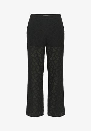 Pantalons en dentelle noire avec un motif, des jambes larges, et une taille douce, avec des sections transparentes pour ajouter de la texture.