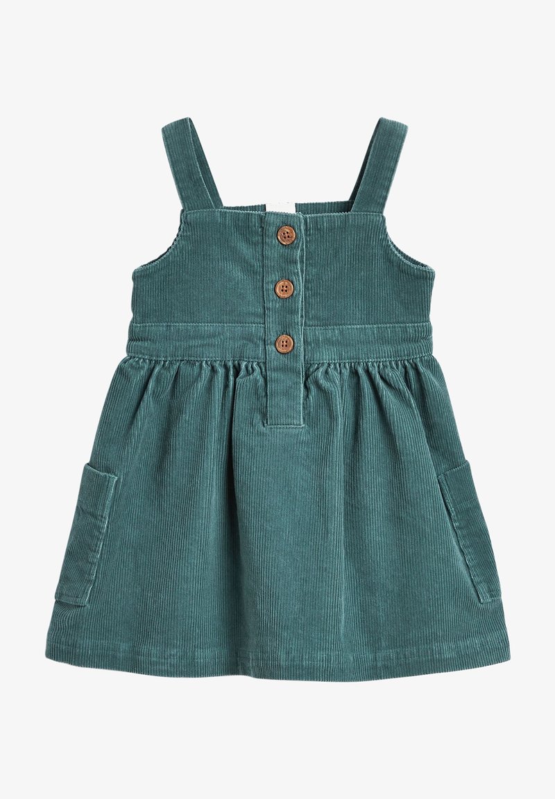 Robe bébé en velours côtelé vert sarcelle avec bretelles, trois boutons en bois sur le devant, taille froncée et poches plaquées sur les côtés.