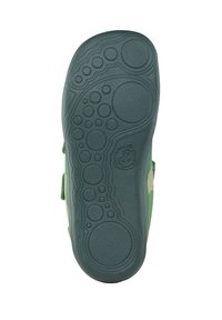 Groene kinderschoenzool van textuur rubber, met sterke grippatronen in cirkels en ovalen, en een schattig karakterlogo dat aan de zijkant is gedrukt.