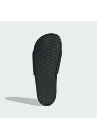 Black rubber flip-flop with a textured pattern on the sole, featuring an embossed "adidas" logo on the strap for branding.