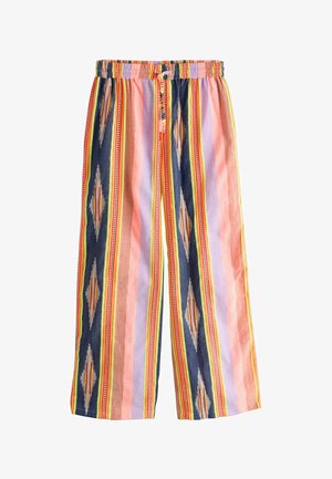 Weit geschnittene Hose mit elastischem Bund und mehrfarbigen vertikalen Streifen mit geometrischen Mustern in Marineblau, Pink, Orange, Gelb und Helllila.
