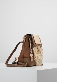 Brown leather handbag with a textured cream panel, gold hardware accents, and a detachable strap. Dimensions suggest a medium size.