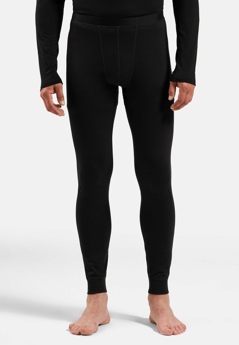 Black thermal leggings made from stretchy material, featuring a fitted design, elastic waistband, and snug cuffs at the ankles.
