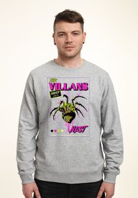 Grå sweatshirt med en färgglad grafisk design. Trycket visar en stiliserad spindel med texten "THE VILLAINS NEST" i fet, livfulla färger.