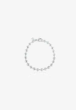 Pulsera de plata que presenta una serie de cuentas redondas pulidas con cierre de langosta. Textura suave, tamaño de cuentas uniforme y brillo.