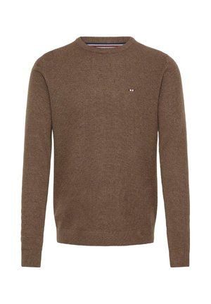 Pruun kudumine särk, ümmargune kaelus, pikad varrukad, soonilised mansetid ja hem, esiküljel väike logo punases, valges ja sinises värvitoonis.