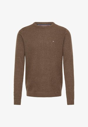 Pruun kudumine särk, ümmargune kaelus, pikad varrukad, soonilised mansetid ja hem, esiküljel väike logo punases, valges ja sinises värvitoonis.