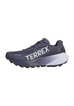 Purple running shoe with mesh upper, bold "TERREX" branding, textured sole, and layered design featuring white and dark grey accents.