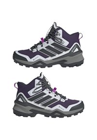 Bottes de randonnée violettes avec une tige en tissu texturé, des superpositions en synthétique, une semelle noire et des accents blancs contrastés. Elles disposent de lacets durables et d'une languette au talon.