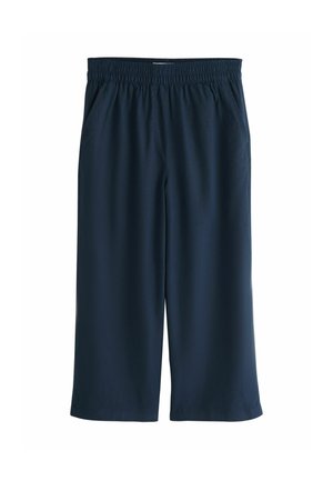 Navy blue loose-fit pants with elastic waistband and side pockets, cropped length, made from lightweight fabric.