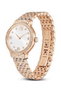 Zegarek w kolorze różowego złota z kryształowymi ozdobami, białą teksturowaną tarczą i bransoletą składającą się z szeregów błyszczących elementów.