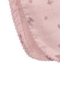 Pink fabric with small floral patterns, featuring a scalloped edge and fine stitching along the border. Soft texture and lightweight.